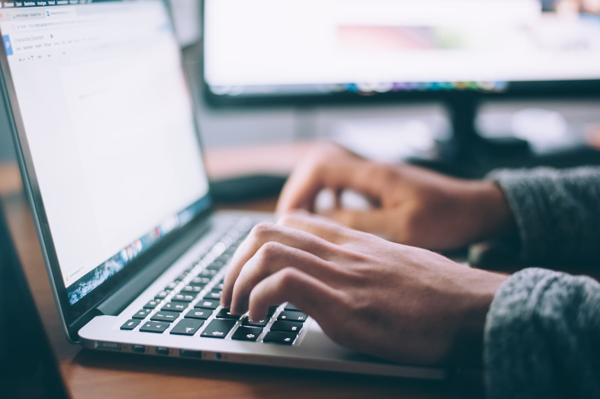 User looking through website on laptop