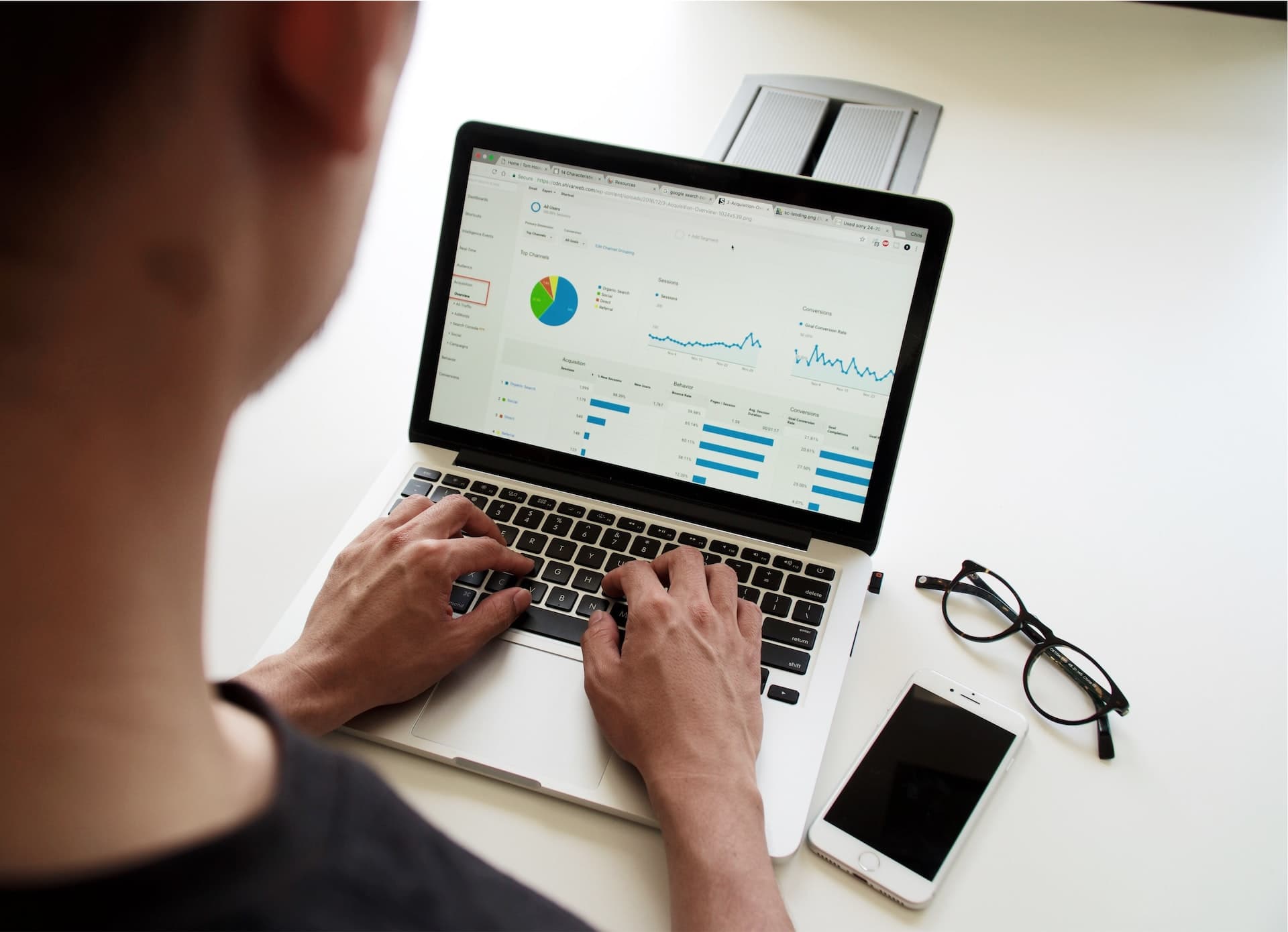 User looking through website on laptop