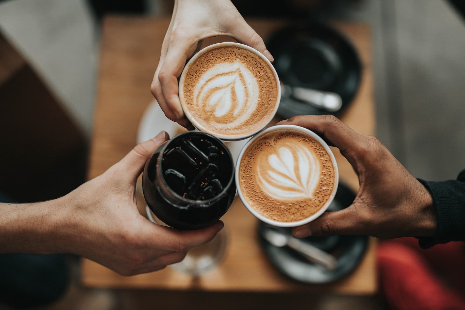People sharing hot drinks
